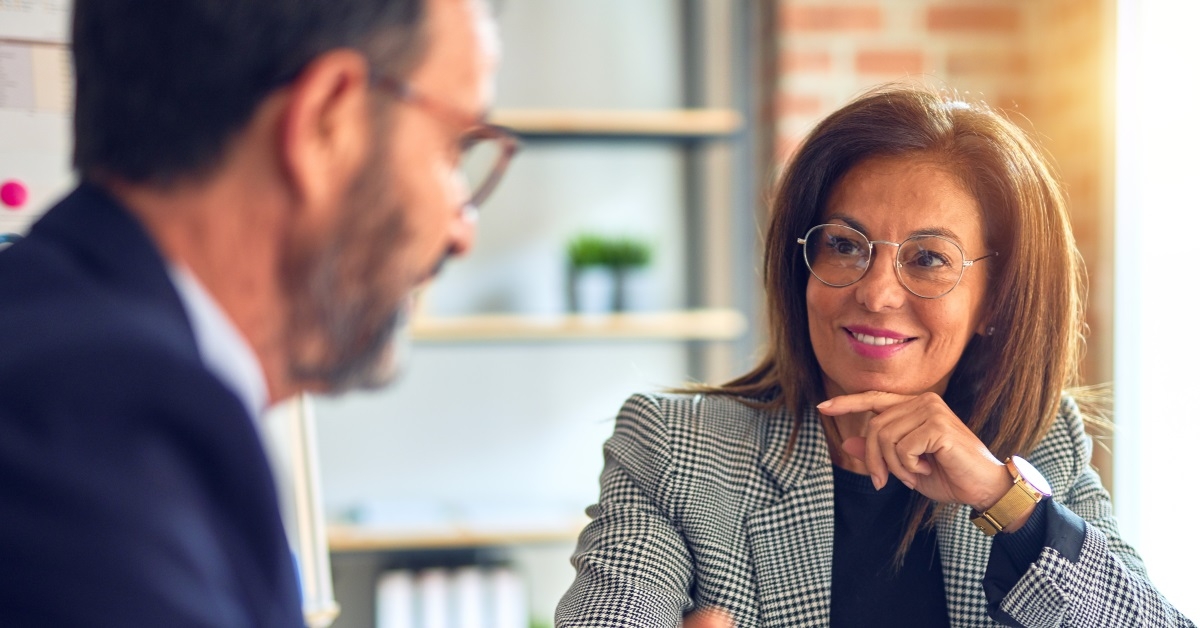 two business people discussing work in office