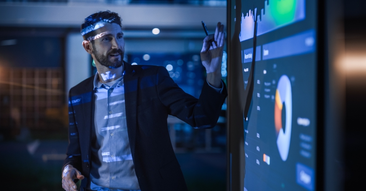 businessman shows data to group of investors