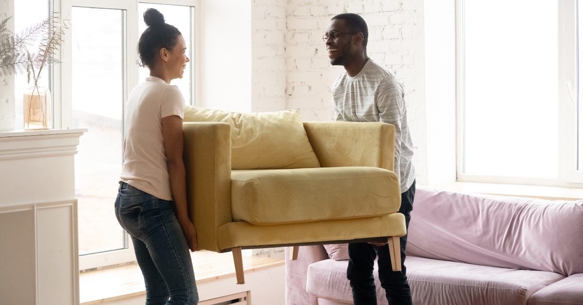 couple moving and carry table