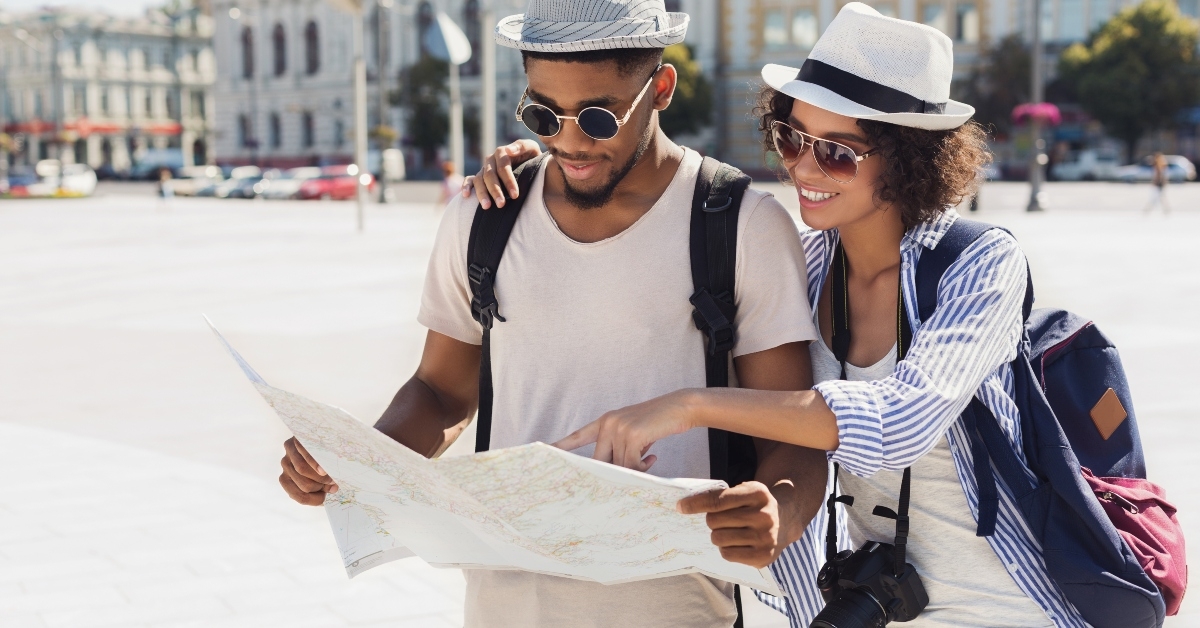 couple planning walk route with map