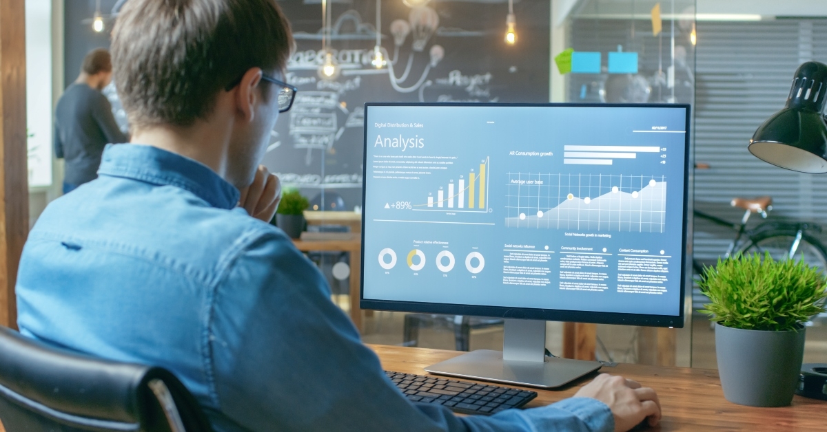 financier works on a personal computer showing statistics