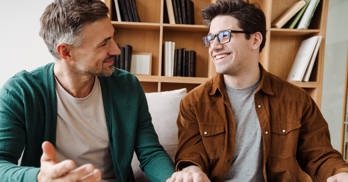 male gay couple talking while relaxing