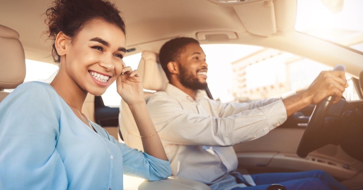 couple driving in car travelling together