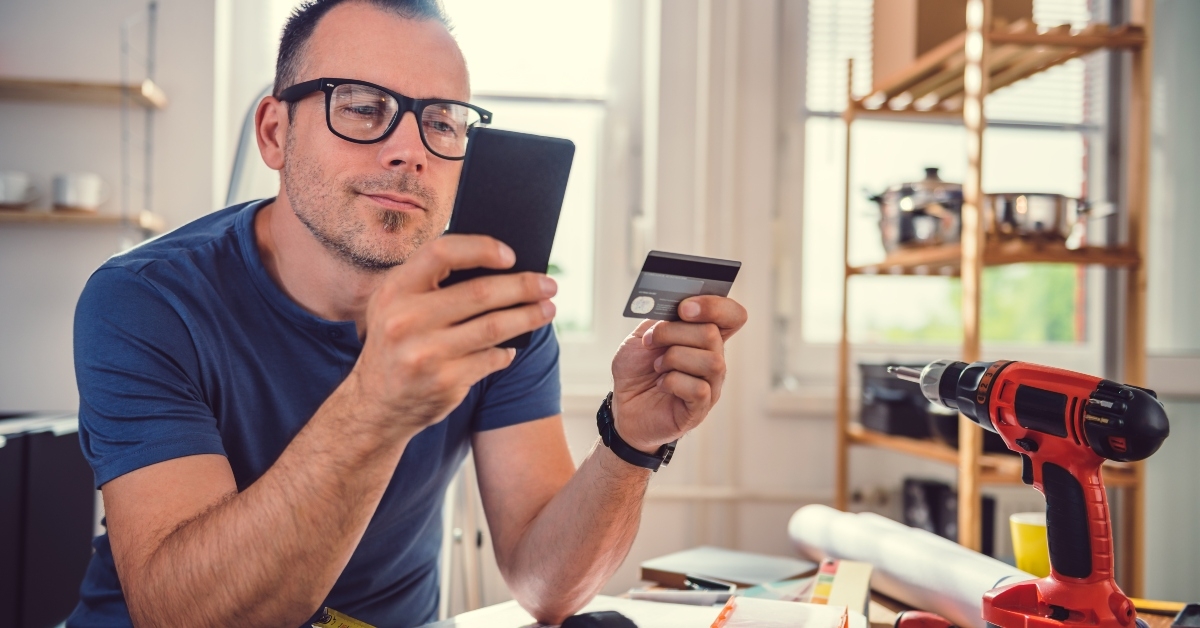man shopping online during kitchen renovation