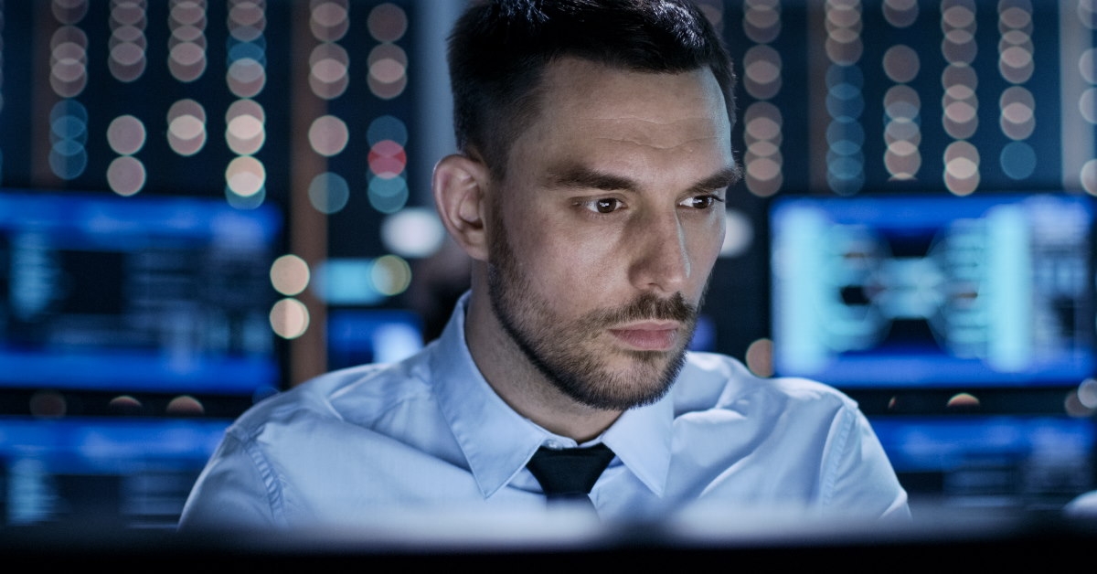 young professional man at office using desktop 