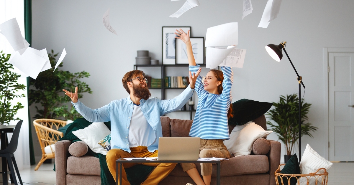 married couple with bills receipts documents