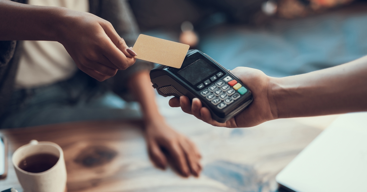 woman paying with credit card
