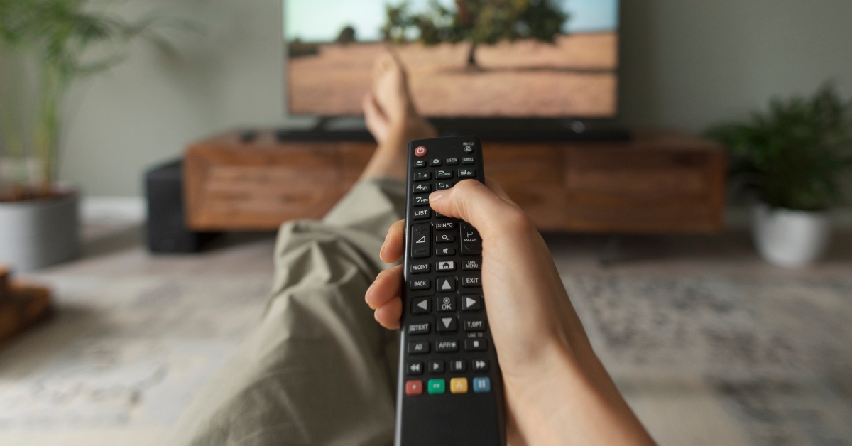 woman watching TV at home