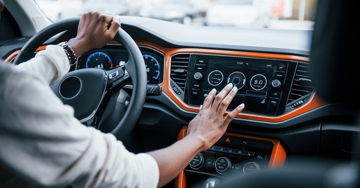 woman's hands inside of new modern car
