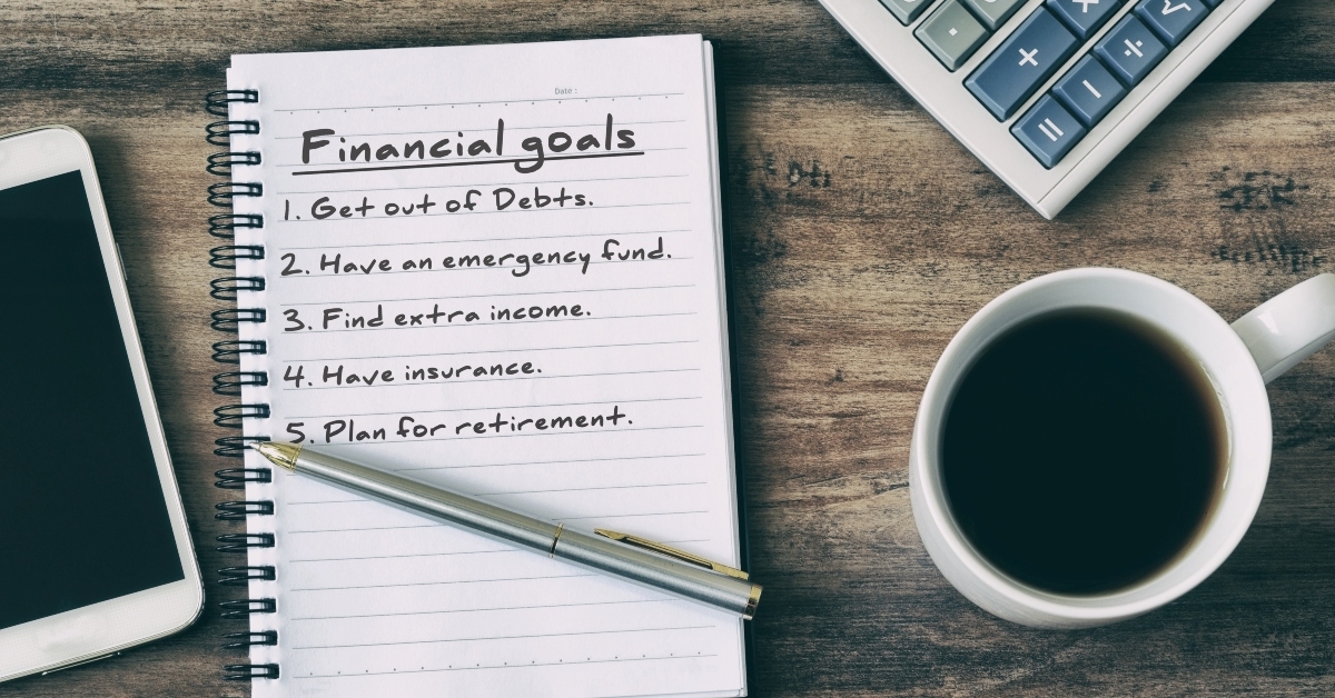 financial goals on notepad with calculator