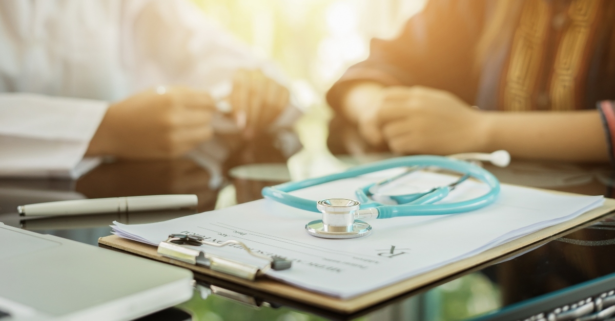 stethoscope with clipboard and laptop