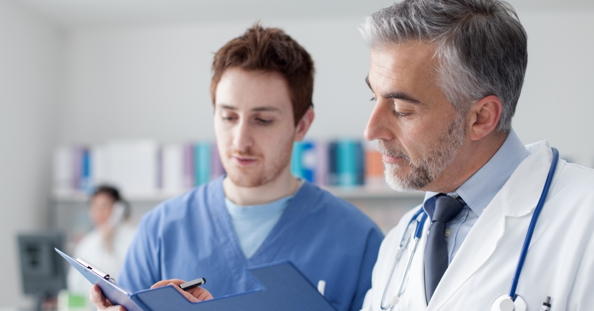 doctors examining patient's medical records