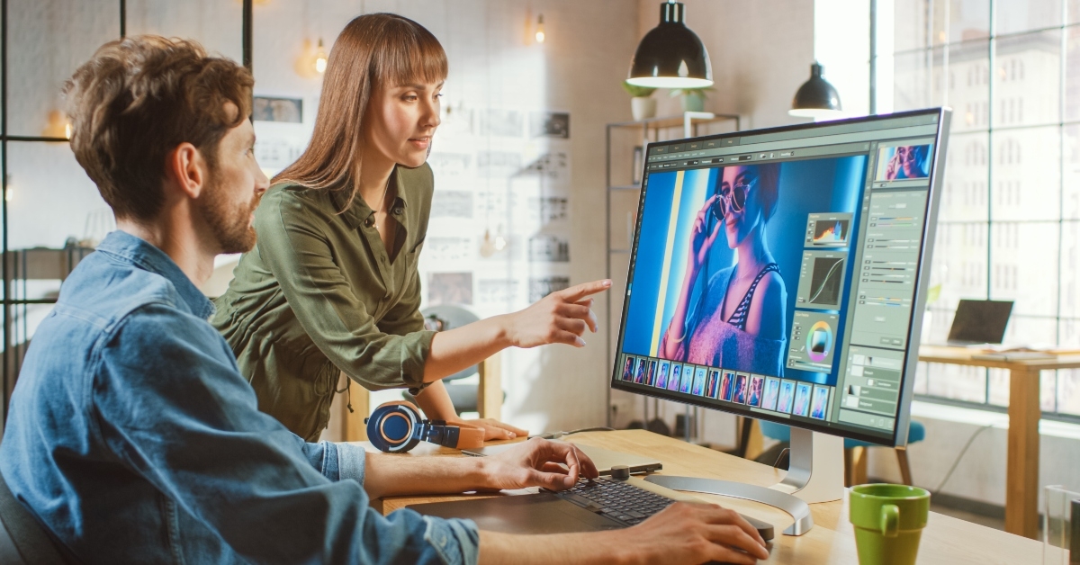 female art director consults designer colleague