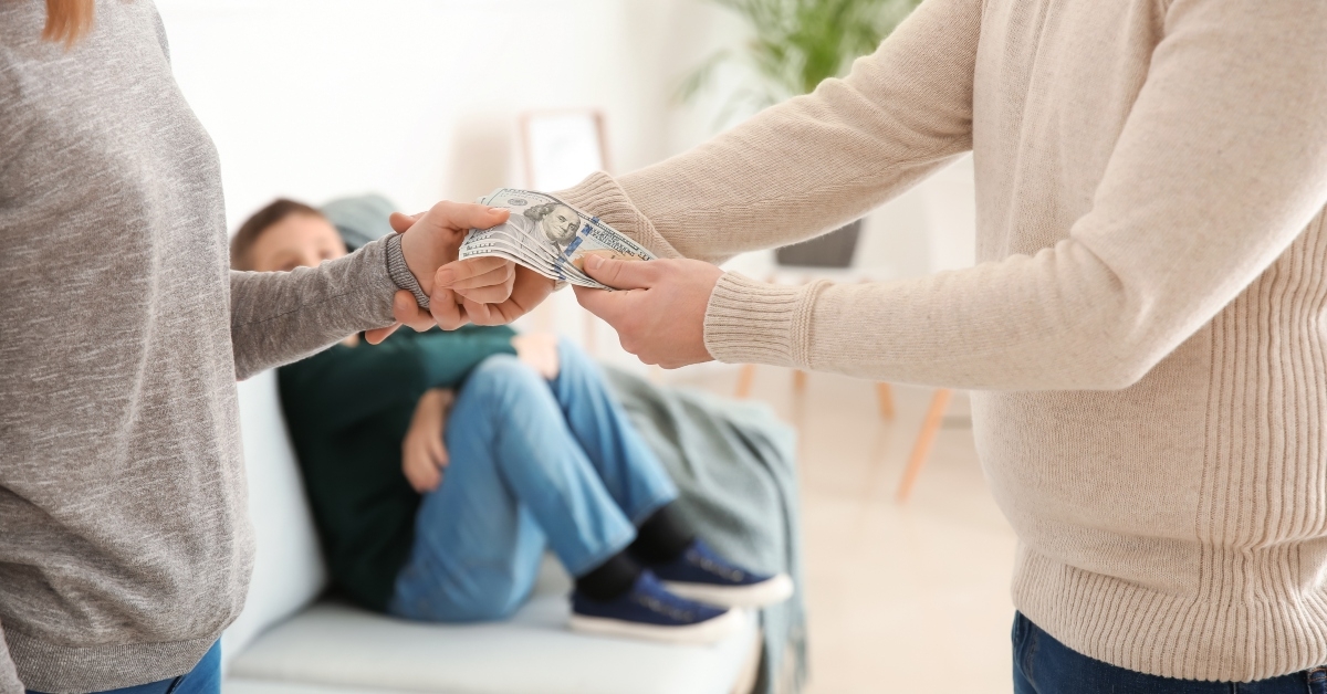 man giving alimony to his ex-wife at home