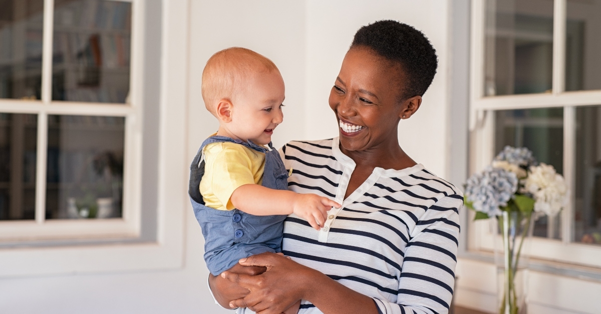 mother holding adopted child