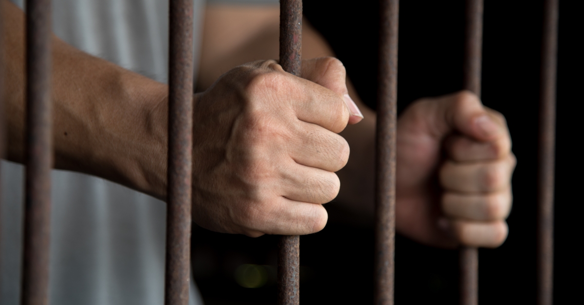 hands of the prisoner in jail