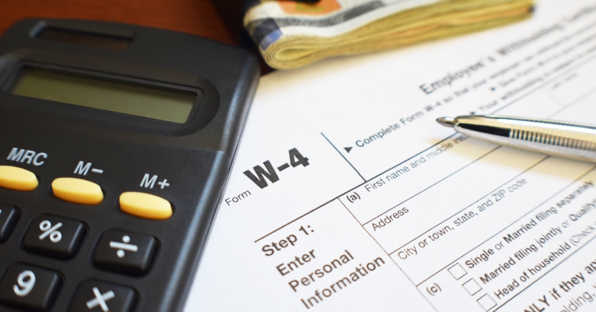 W-4 tax form with pen