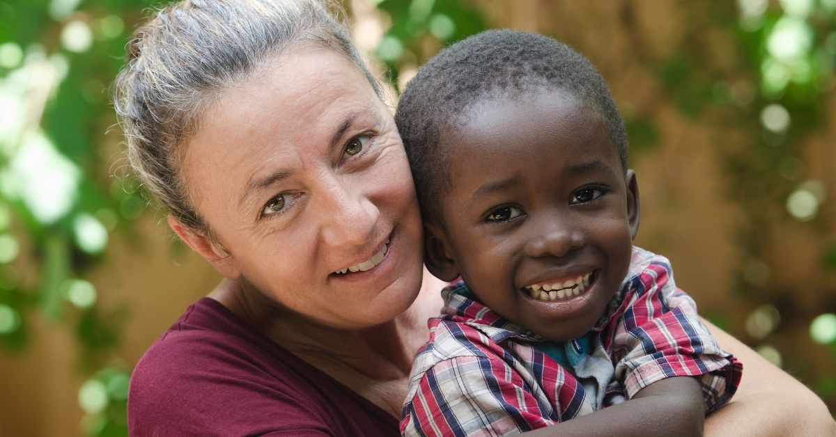 woman adopts a little African boy