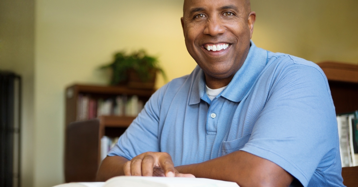 middle age student working in library
