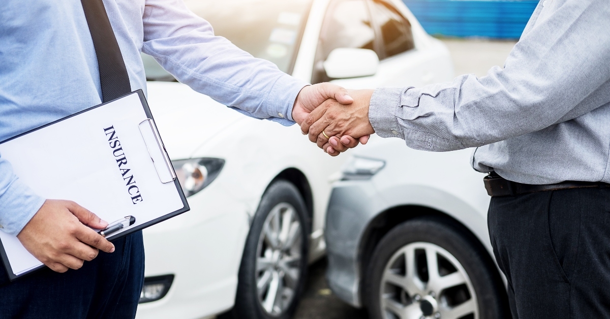 customer shake hand with auto insurance agents