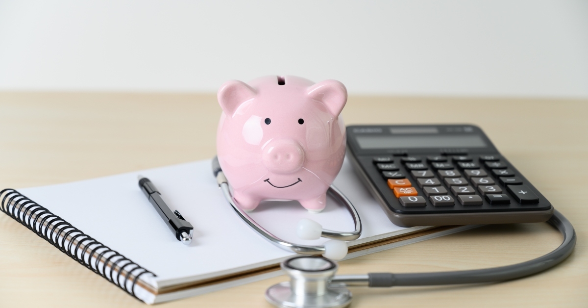 piggy bank with stethoscope financial checkup