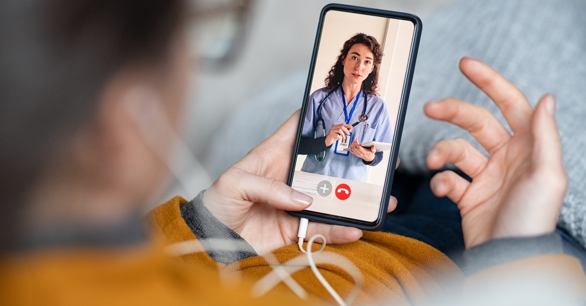 woman doing video call with doctor