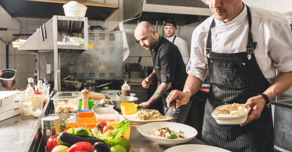 chef cooking in the kitchen restaurant at the hotel