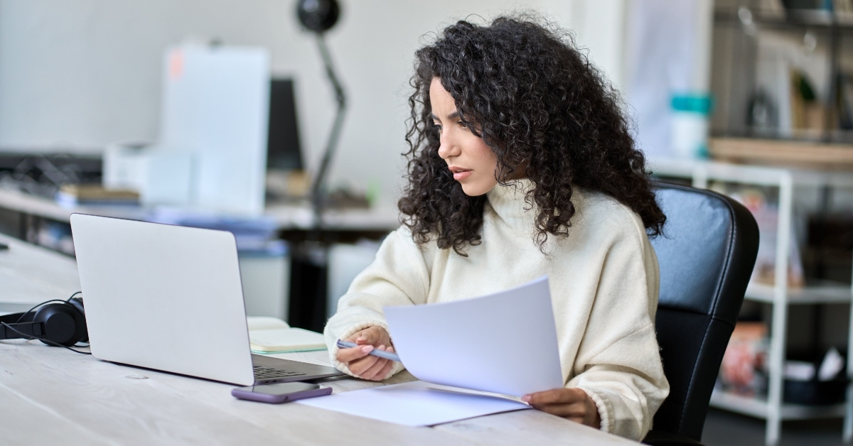 female accounting analyst checking bills