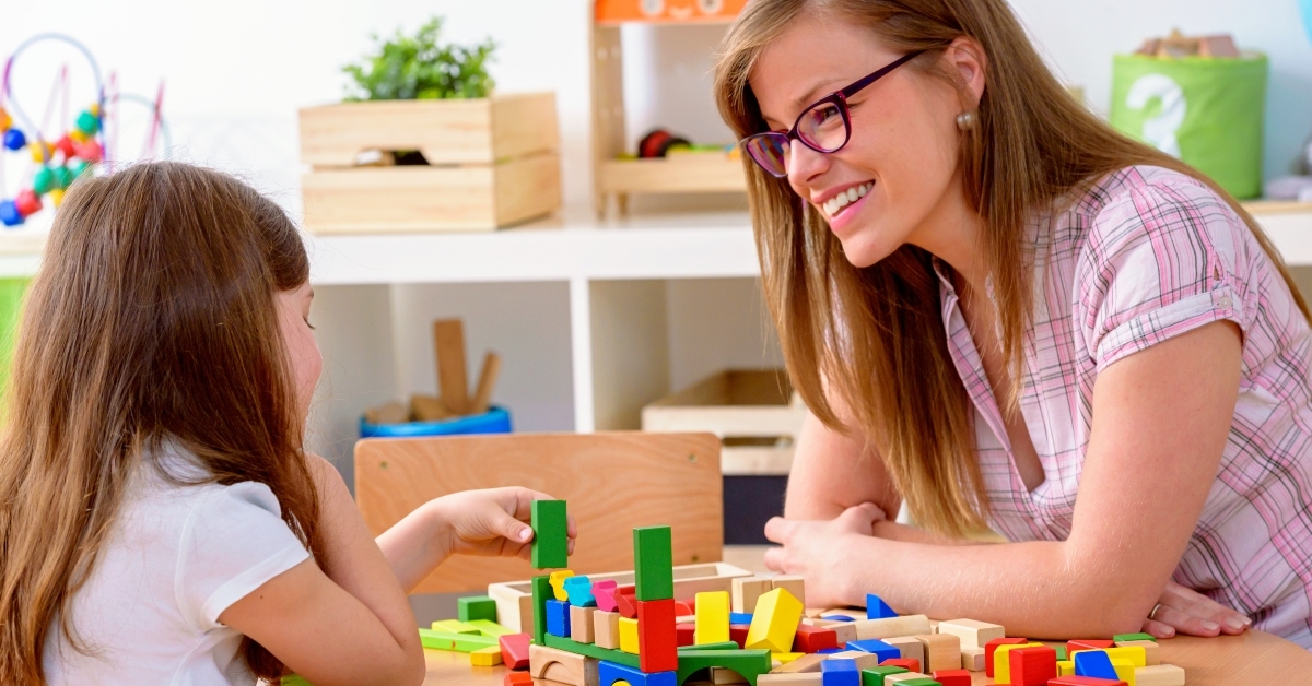 pre-school teacher and little girl
