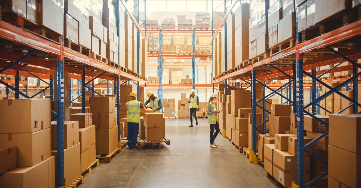 retail warehouse full of shelves with goods in cardboard boxes
