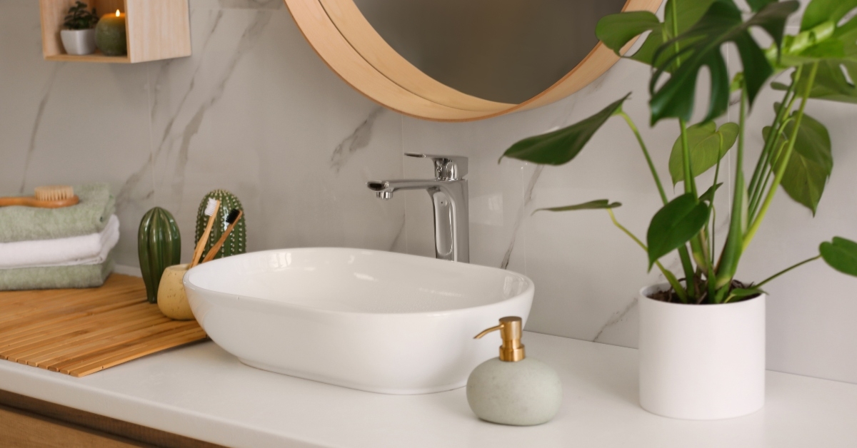 stylish vessel sink on light countertop in modern bathroom