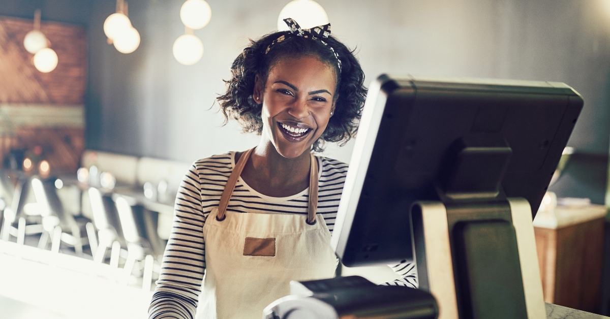 waitress laughing while working in a trendy restaurant