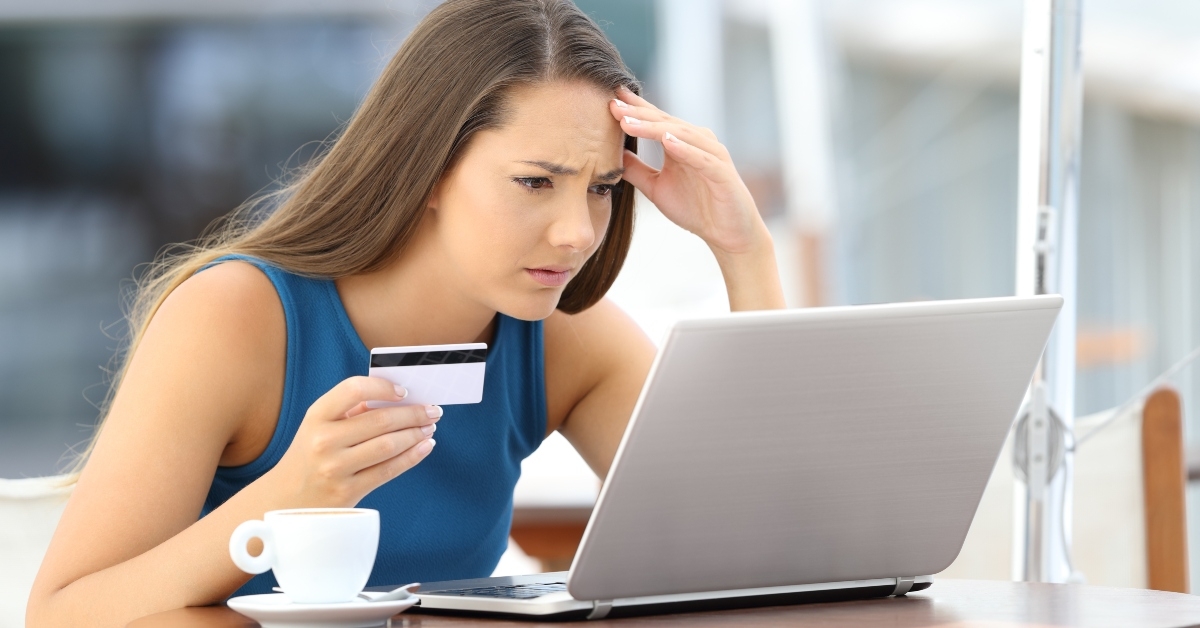 worried shopper paying with credit card