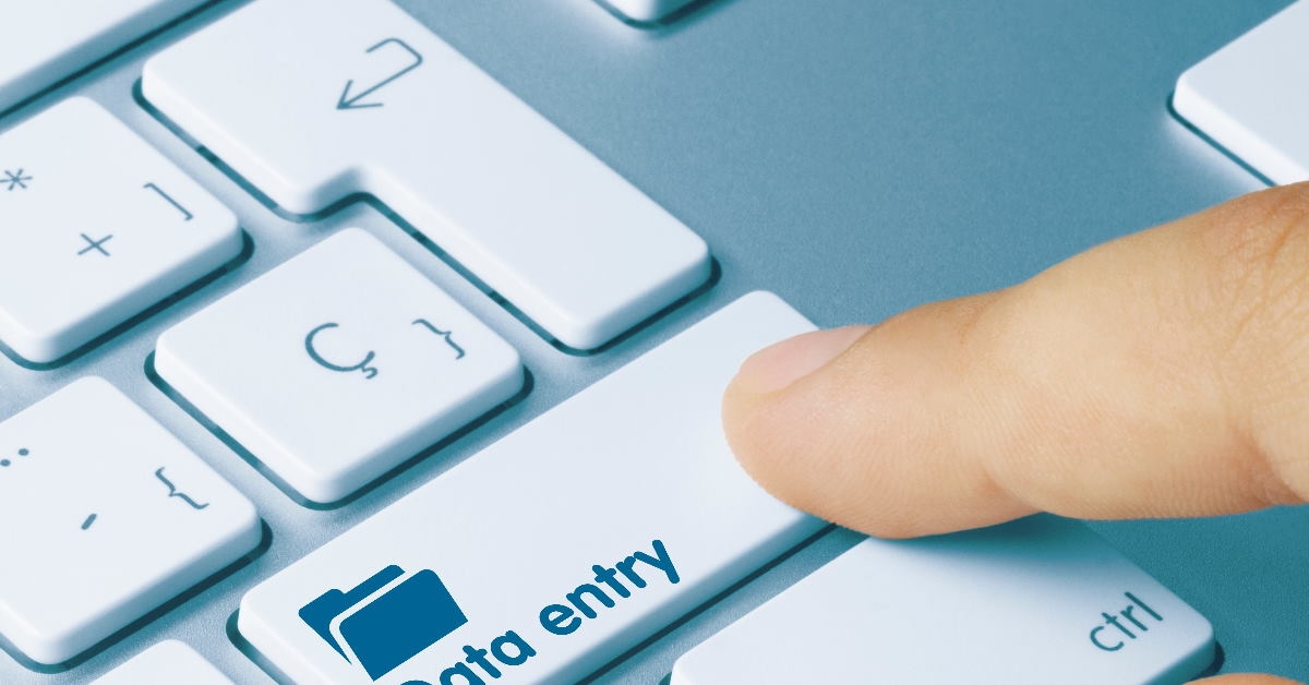 finger clicking data entry key on keyboard 