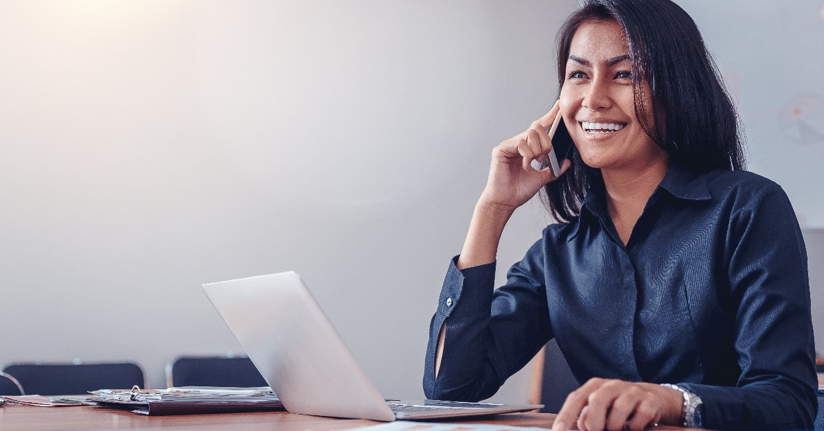 business woman in black shirt talking on mobile