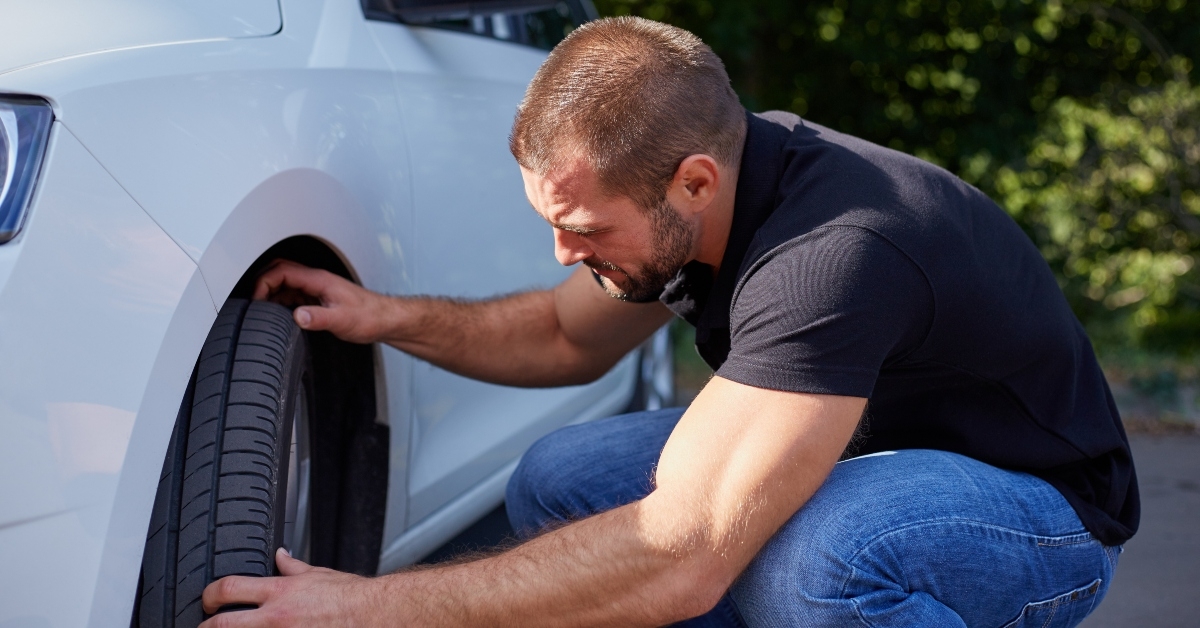 Man checking his tires
