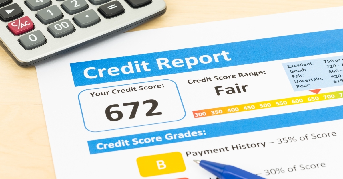 fair credit score report with pen and calculator