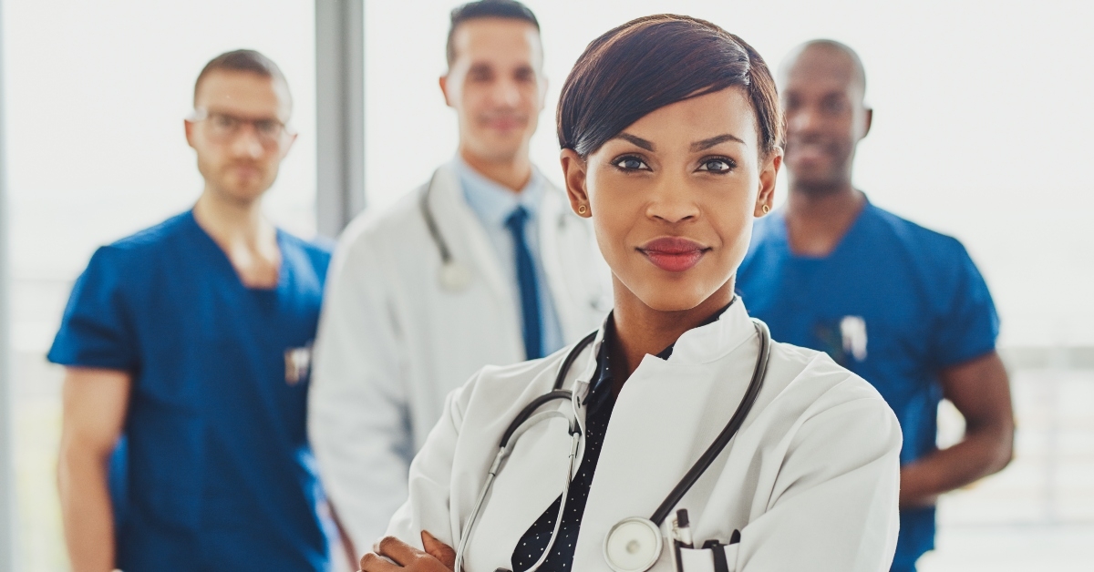black female doctor in front of medical team