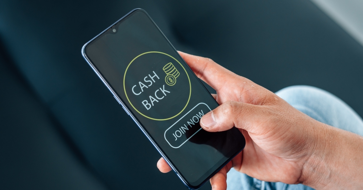man using cashback app on phone