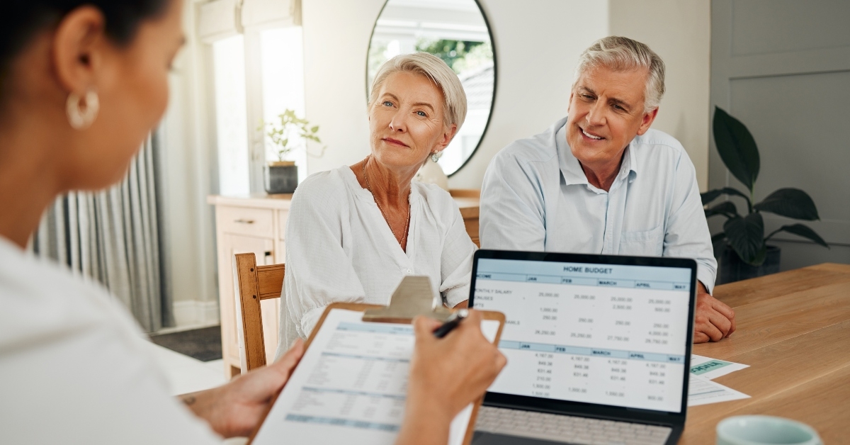 couple and accountant with finance documents