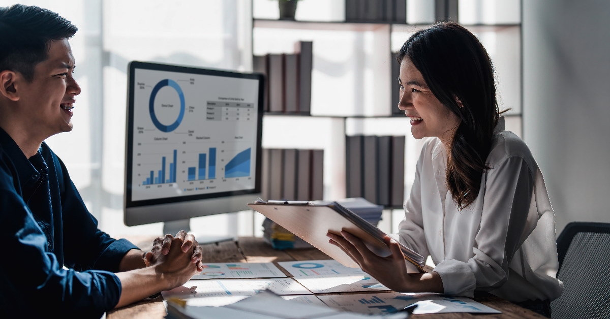 happy colleagues discussing work