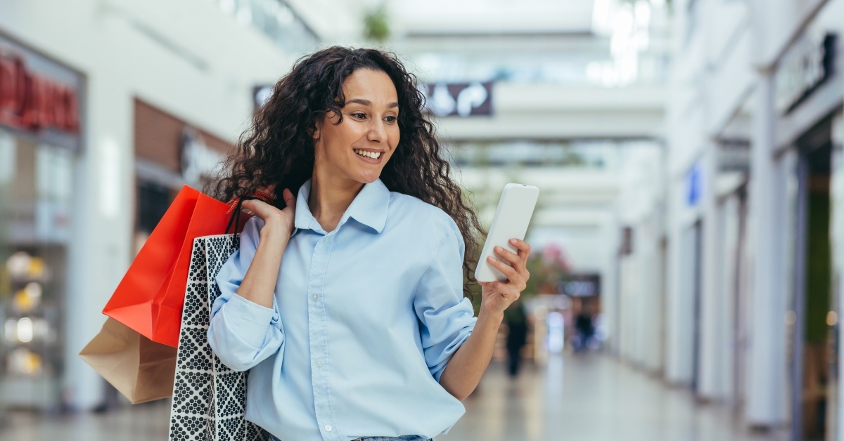 happy woman shopping for clothes 
