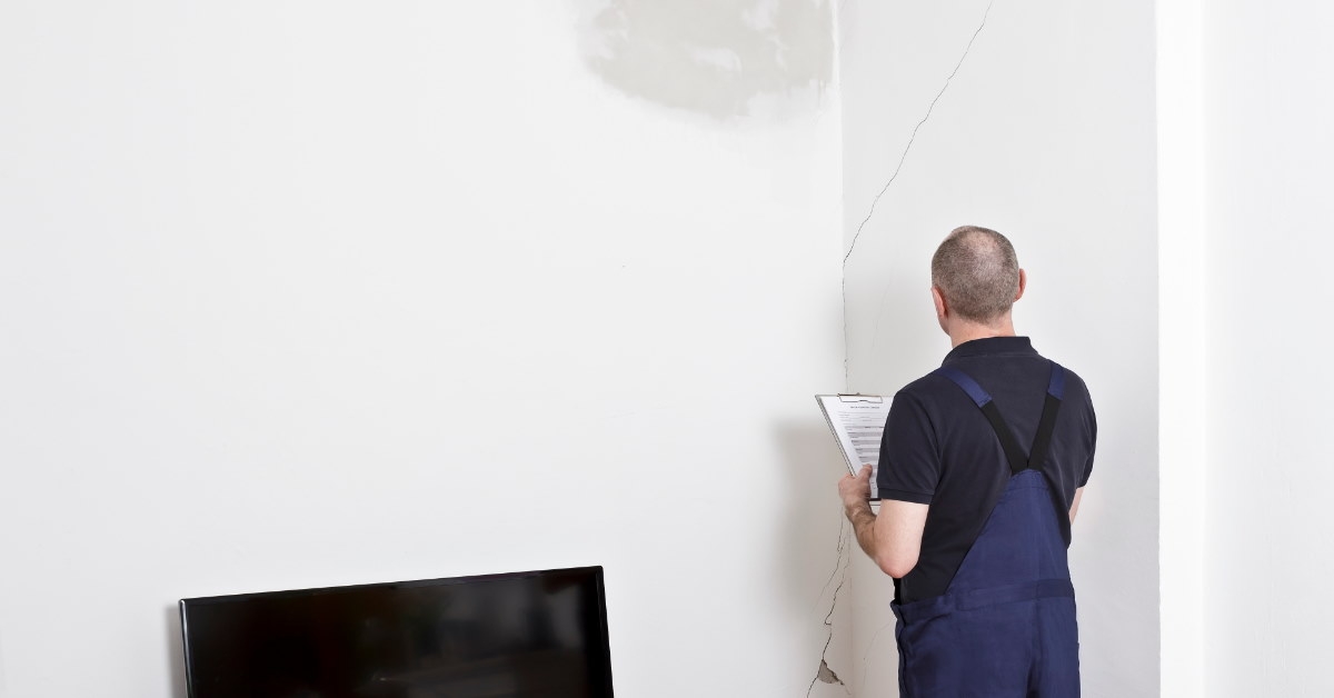 janitor standing with checklist