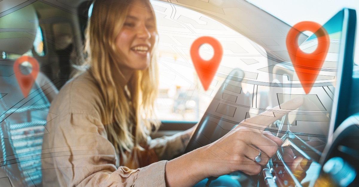 woman selects the destination with car gps navigator