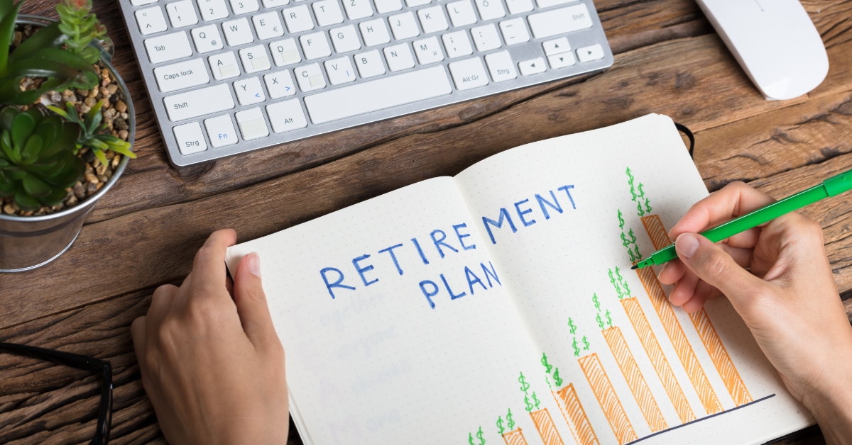 drawing retirement plan growth graphs on paper 