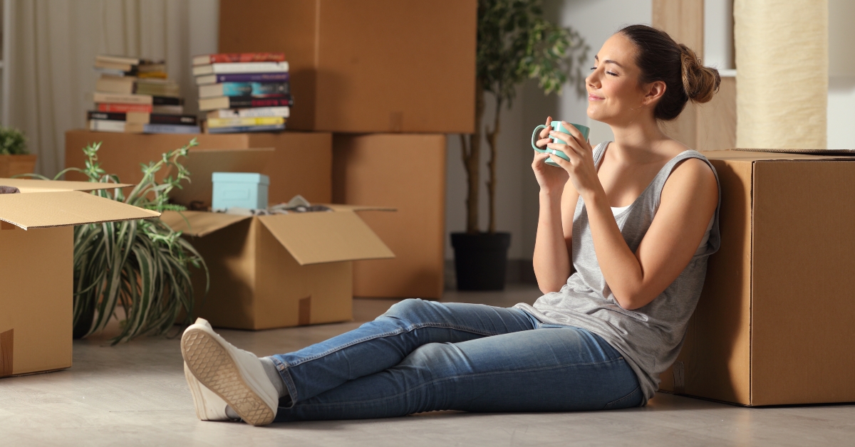 happy tenant resting after moving home 