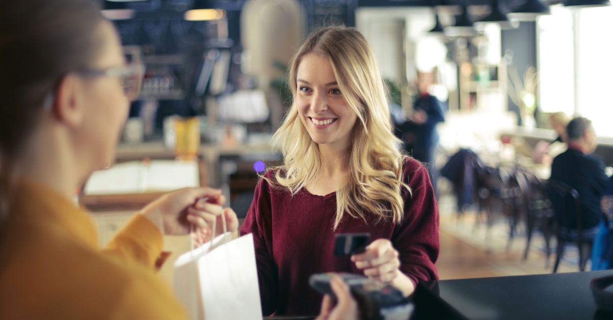 woman buying at a shop