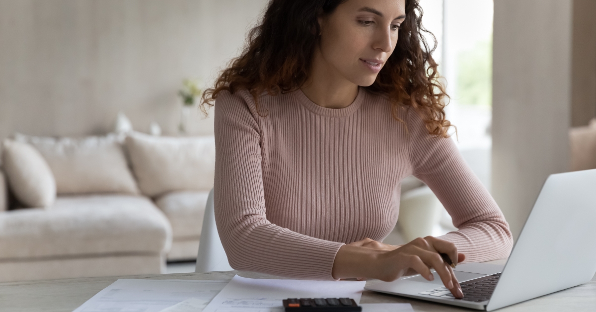 woman calculates finances