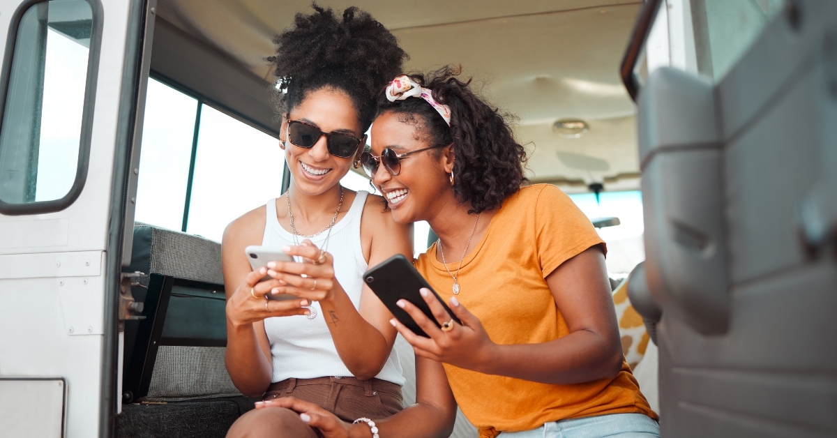 women sharing moments of traveling on mobile smartphone