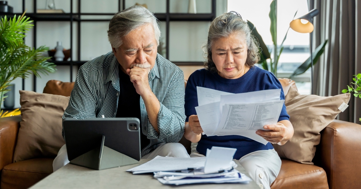 asian senior couple checking and calculate financial billing 